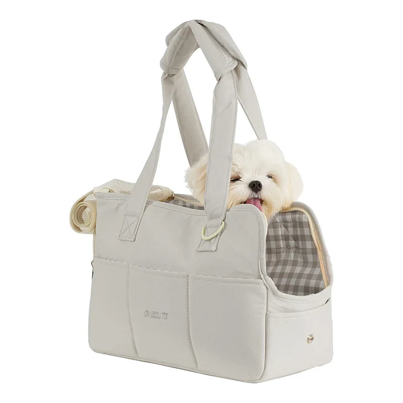 Sac de transport gris avec petit chien et ouverture latérale